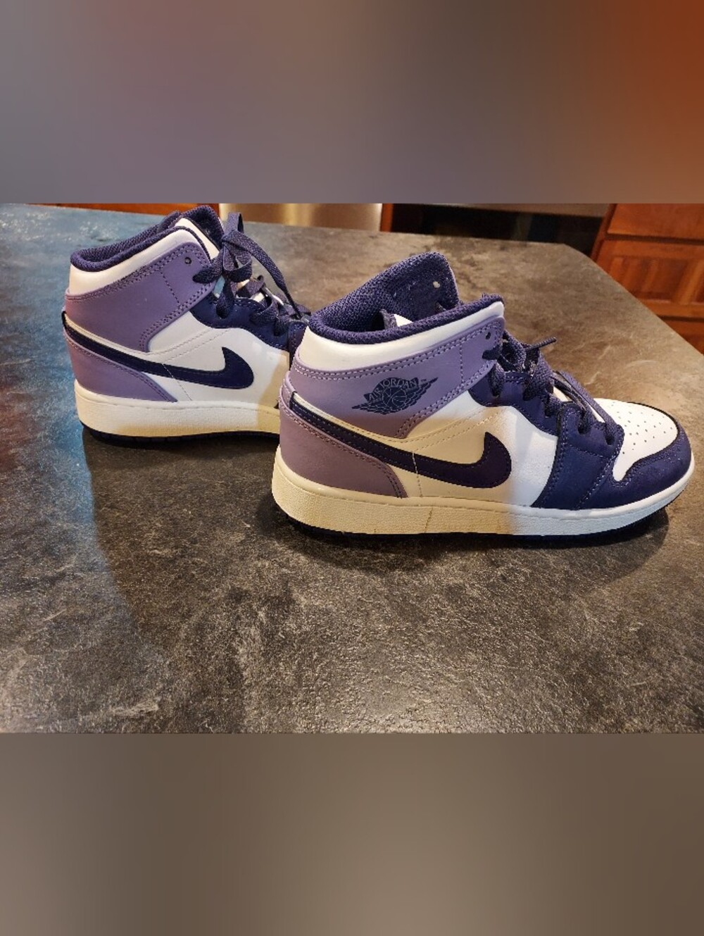 Nike Air Jordans Purple and White High-Top Sneakers